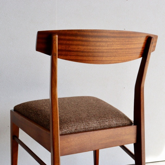 Vintage teak McIntosh mid-century dining chair from Denmark with curved backrest and brown upholstered seat.