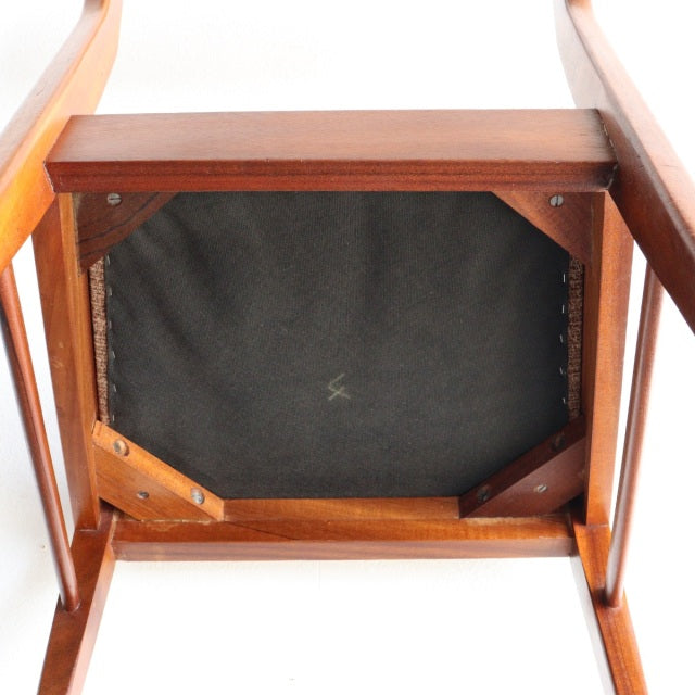 Vintage McIntosh dining chair in teak with visible wood grain, mid-century British design, sturdy legs and fabric seat.