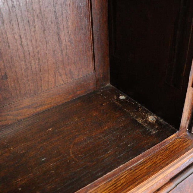 Close-up of vintage teak wood cabinet interior with rich grain and patina, showcasing mid-century British craftsmanship from .