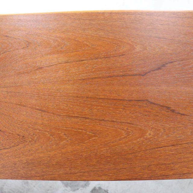 Vintage teak wood surface of British mid-century Nathan sideboard with rich grain patterns.
