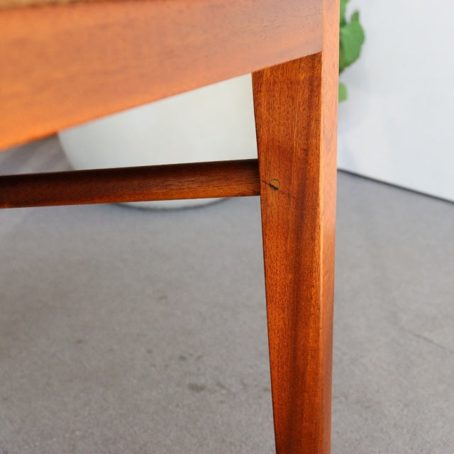 Mid-century British vintage teak dining chair leg with rich wood grain and clean lines from McIntosh.