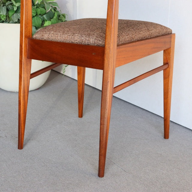 Vintage teak McIntosh dining chair with mid-century British design, tapered legs, and brown upholstered seat.