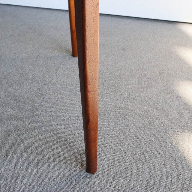 Mid-century British teak dining chair leg by McIntosh with rich wood grain and tapered profile.