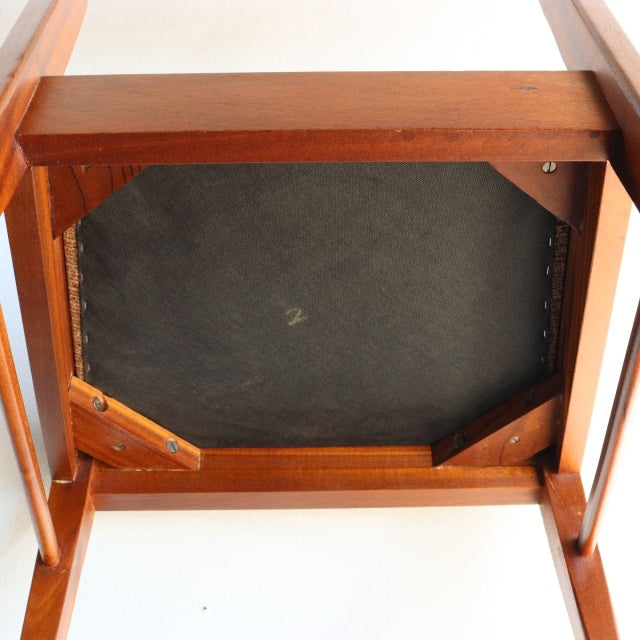 Mid-century vintage teak dining chair bottom view showing solid wood frame and metal screw details by McIntosh British.
