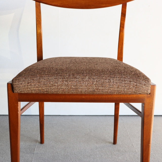 Vintage mid-century teak dining chair by McIntosh with British-Denmark design, textured brown fabric seat, clean wood grain, .