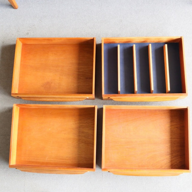 Set of four vintage teak drawers with visible wood grain, five compartments in one, mid-century British design by Younger.