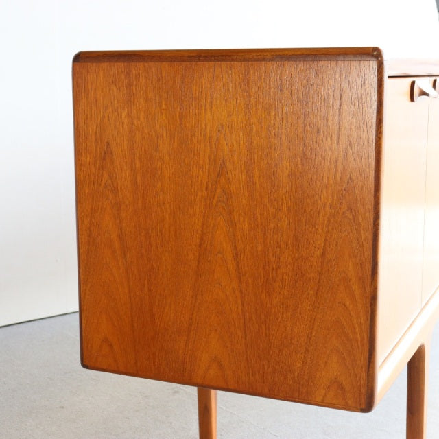 Vintage mid-century teak sideboard by Younger, British design with rich wood grain and slender legs.