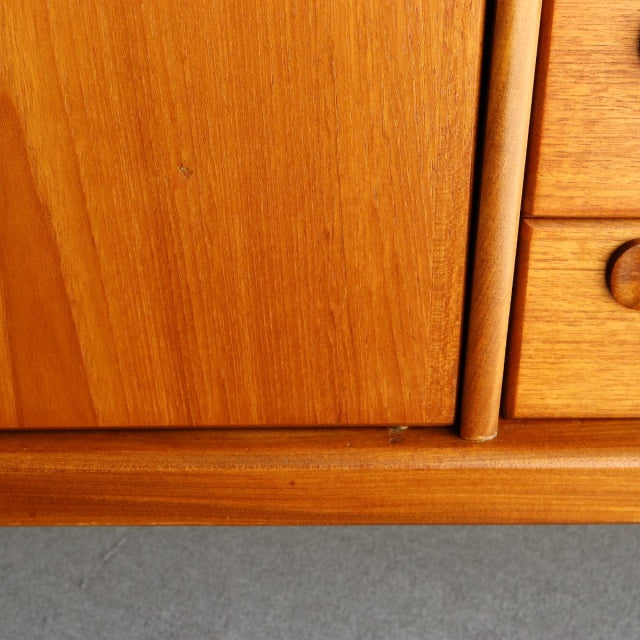 Vintage teak sideboard from Younger, British mid-century style, smooth wood grain, rounded legs, warm honey finish.