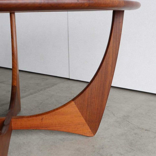 Mid-century British vintage teak coffee table leg with elegant curved design and rich wood grain.