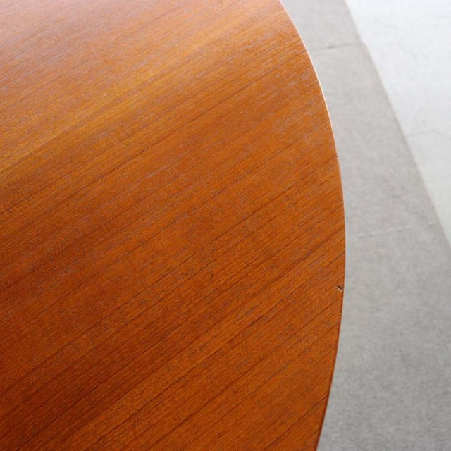 Round vintage teak dining table top showing fine wood grain, warm mid-century finish by Edward Valentinsen, Denmark-British.
