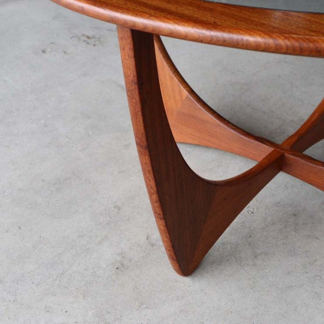 Mid-century British G-Plan Astrol Round coffee table leg in rich teak with smooth wood grain and sculpted triangular form.
