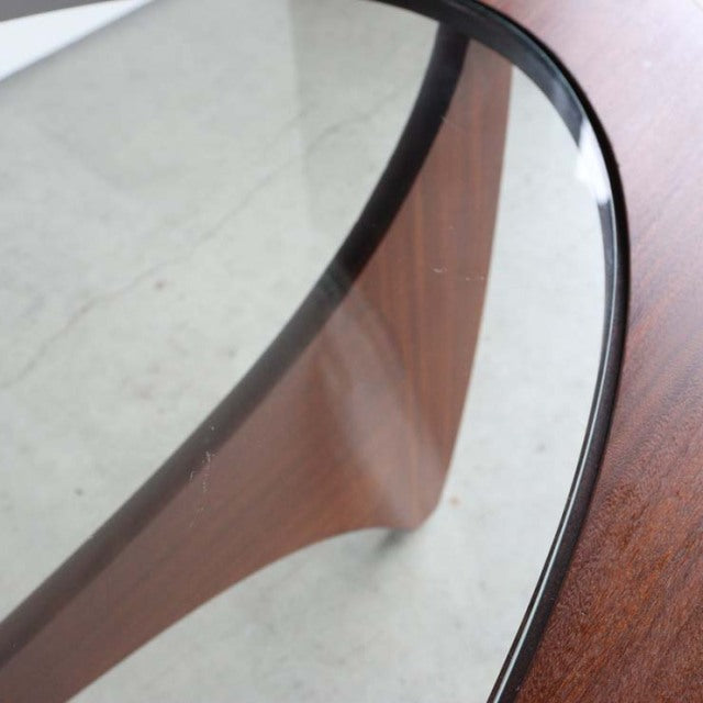 Mid-century British vintage G-Plan teak coffee table with oval glass top and elegant wood grain legs.