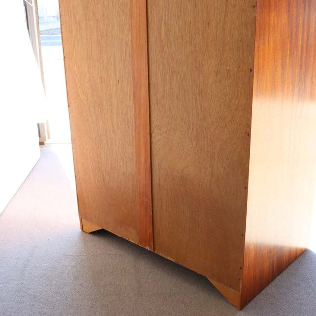 Vintage teak mid-century wardrobe by William Laurence, British-Denmark style, showing smooth wood grain and tapered legs.