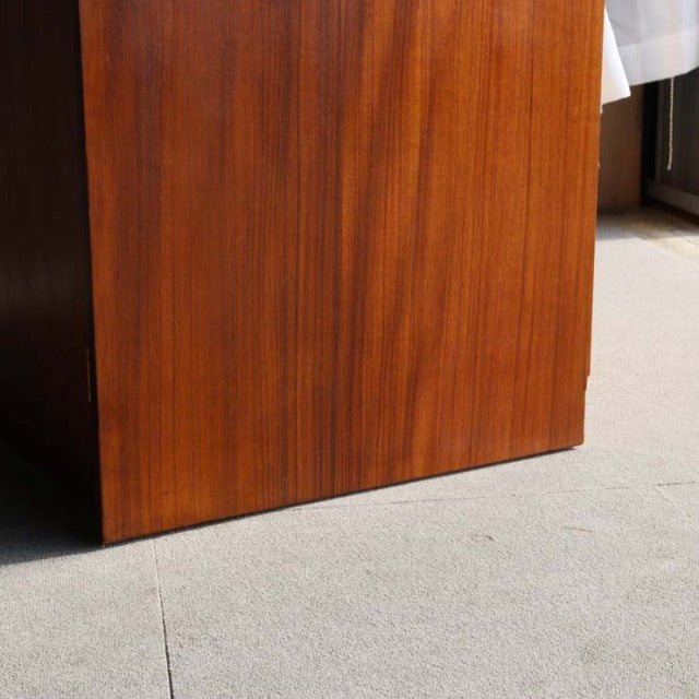 Vintage mid-century teak cabinet by William Laurence, showcasing rich wood grain and clean British design lines.