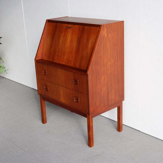 Vintage mid-century teak bureau by Gunnar Nielsen Tibergaard, Danish design with rich wood grain, clean lines, and tapered.