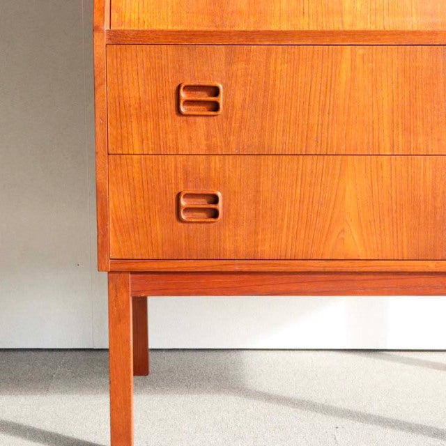 Mid-century vintage teak bureau by Gunnar Nielsen Tibergaard, Denmark, with rich wood grain and recessed handles on slender.
