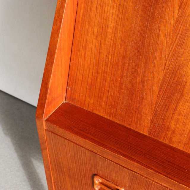 Mid-century vintage teak bureau corner showing rich wood grain and smooth, warm finish from Denmark design by Gunnar Nielsen .