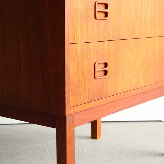 Vintage teak bureau with rich wood grain, mid-century Danish design by Gunnar Nielsen Tibergaard, featuring clean lines and.