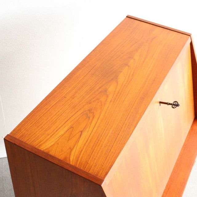 Vintage teak bureau by Gunnar Nielsen Tibergaard, mid-century Danish design with sleek wood grain and angled legs.
