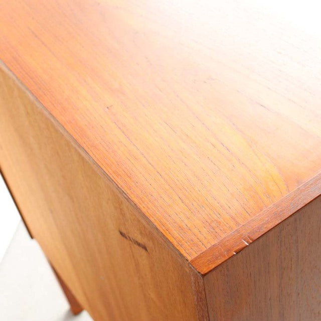 Vintage teak mid-century bureau with smooth wood grain and clean Danish design edges.