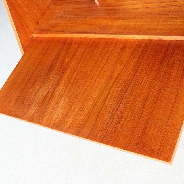 Mid-century vintage teak teakwood bureau top surface with rich grain and warm Danish finish.