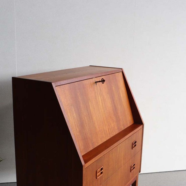 Vintage mid-century teak bureau by Gunnar Nielsen Tibergaard showcasing rich wood grain, clean lines, and British-Denmark.