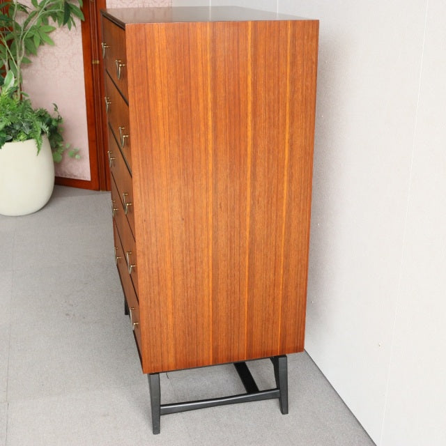 Mid-century vintage teak 5-drawer chest by Meredew with sleek British design and black metal legs.