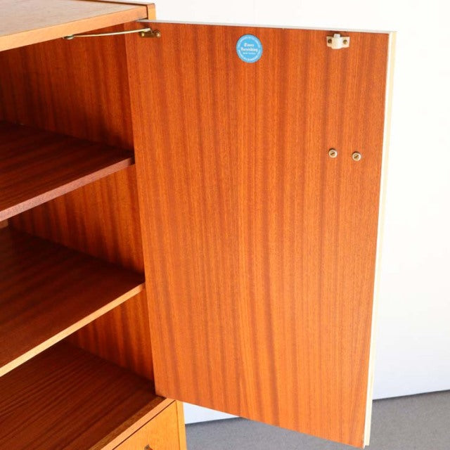 Vintage British mid-century G-PLAN teak cabinet door showing rich wood grain and interior shelves.