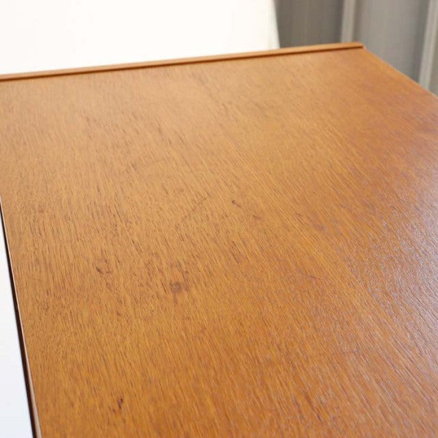 Vintage mid-century G-PLAN teak cabinet top showing warm wood grain and smooth finish.