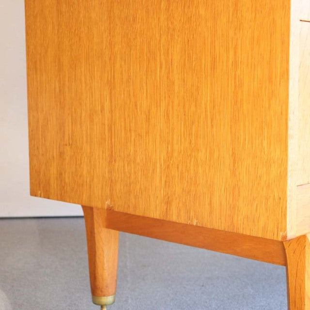 Mid-century vintage teak G-PLAN cabinet leg with visible wood grain and brass-capped foot, British design.