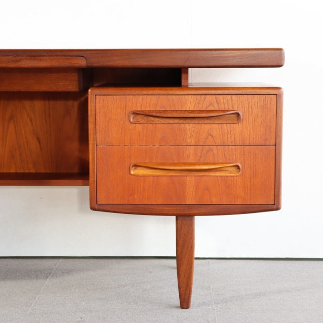 Vintage teak G-Plan British mid-century desk drawer unit with sculpted handles and tapered legs, Danish design influence.