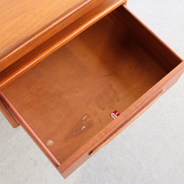 Open drawer of vintage mid-century British G-PLAN teak desk showing smooth wood grain and clean interior.
