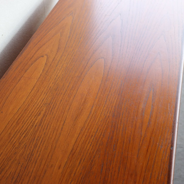Vintage teak G-PLAN British mid-century desk surface with warm wood grain and smooth finish.