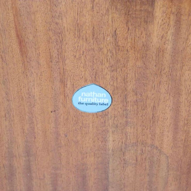 Oval mid-century teak dining table with warm wood grain and British vintage Nathan label from Denmark.