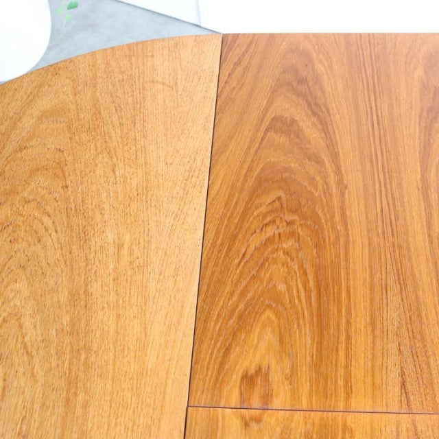 Oval mid-century vintage teak dining table top with distinctive wood grain, British design.