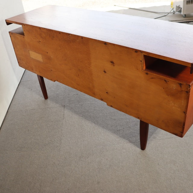 Vintage teak G-Plan mid-century desk with rich wood grain, tapered legs, and British-Denmark design influence.