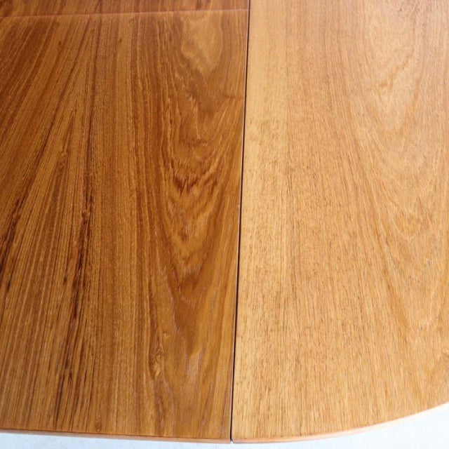 Vintage teak dining table top with rich wood grain, smooth finish, and clean mid-century British design details.
