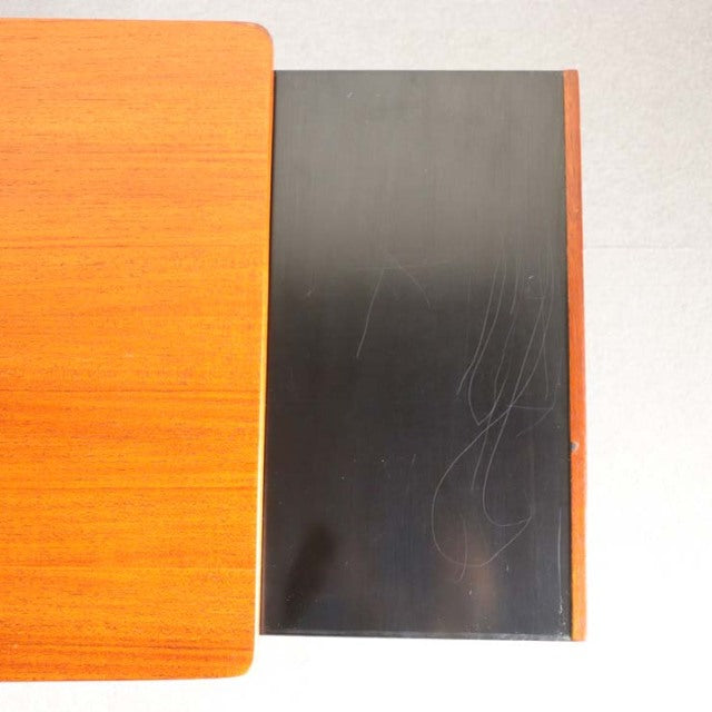 Vintage teak McIntosh mid-century British coffee table with two-tone wood grain and sliding top panel.