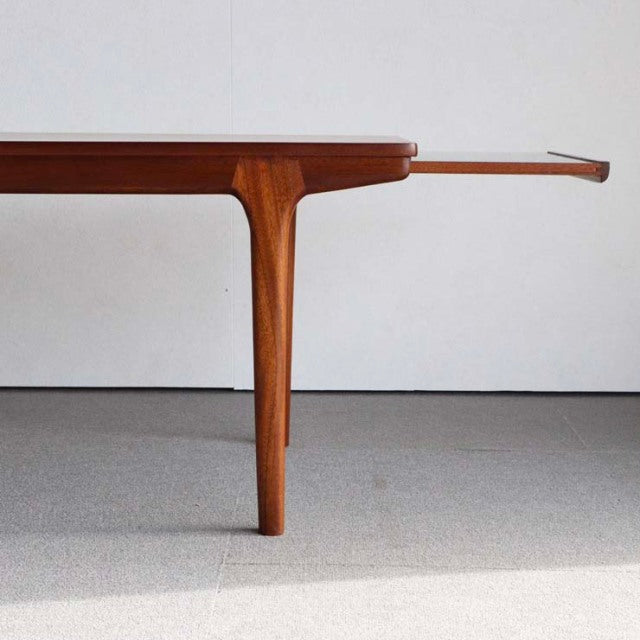 Vintage mid-century McIntosh teak coffee table with sleek tapered legs and clean British design.
