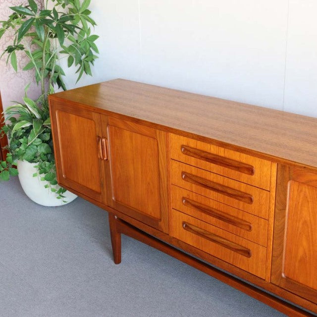 British mid-century G-Plan vintage teak sideboard with rich wood grain, four drawers, and tapered legs.