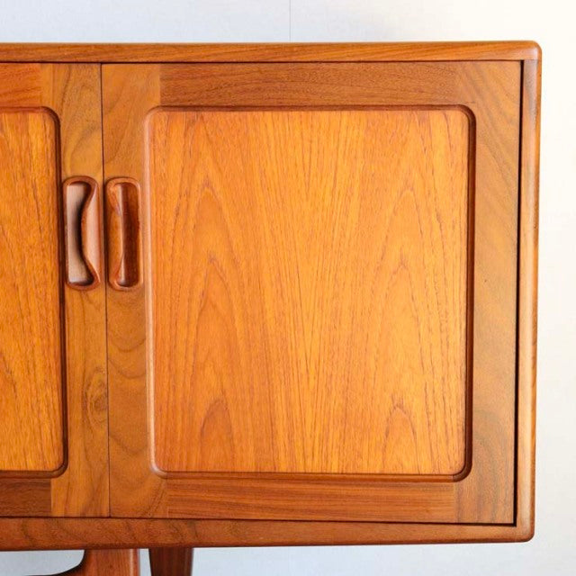 Mid-century British vintage G-PLAN Fresco teak sideboard with smooth wood grain and sculpted handles.