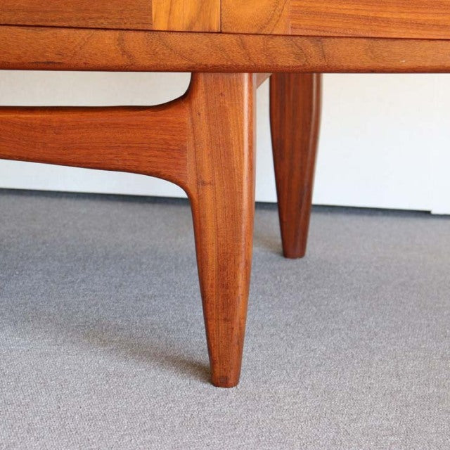 Mid-century British vintage G-Plan teak sideboard leg with tapered, rounded edges and rich wood grain.