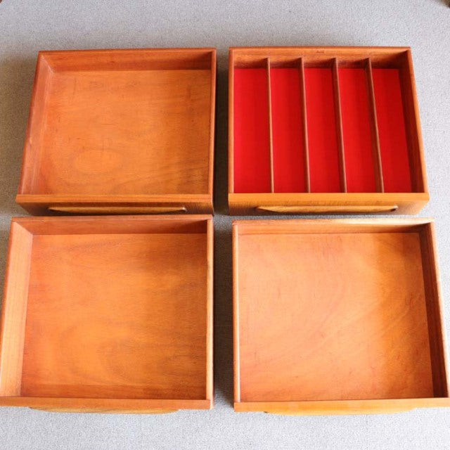 Four vintage teak drawers from British mid-century G-PLAN Fresco sideboard, showcasing warm wood grain and smooth edges, one .
