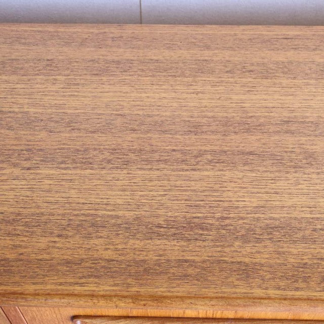 Vintage teak wood surface with fine grain of British mid-century G-Plan Fresco sideboard.