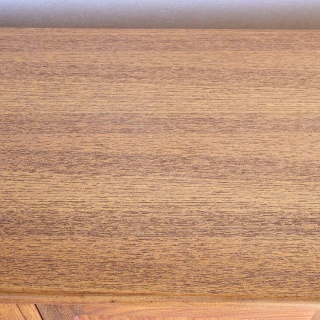 Smooth teak wood grain surface of British mid-century G-PLAN Fresco vintage sideboard.
