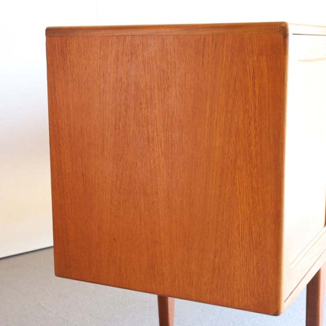 Vintage British mid-century teak G-PLAN Fresco sideboard showing rich wood grain and tapered legs.
