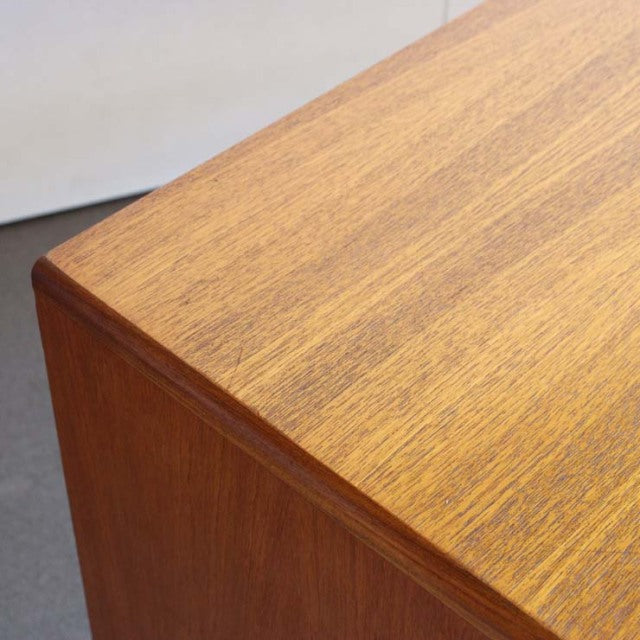 Mid-century British vintage G-Plan Fresco teak sideboard corner with smooth wood grain and clean edge detailing.