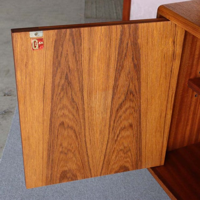 Vintage British mid-century G-PLAN Fresco teak sideboard door panel with rich wood grain and warm tones.