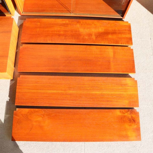 Four vintage teak drawers with smooth wood grain and warm honey tones, mid-century Danish design by Preben Sørensen for.