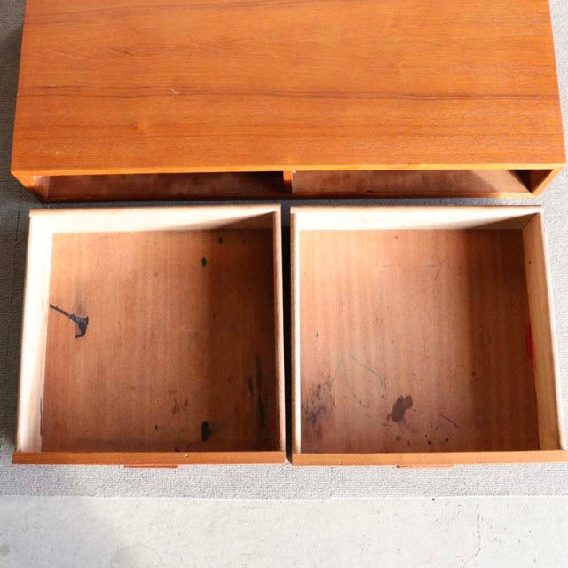 Vintage teak drawers with visible wood grain and subtle wear marks from mid-century British Denmark PS system design.